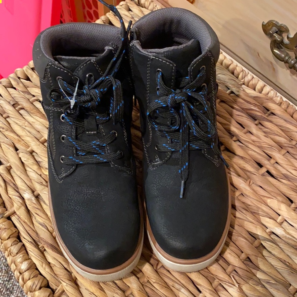 Boys size 4 (big boys) black boots.  Zip side for easy on/off.  Brand new.